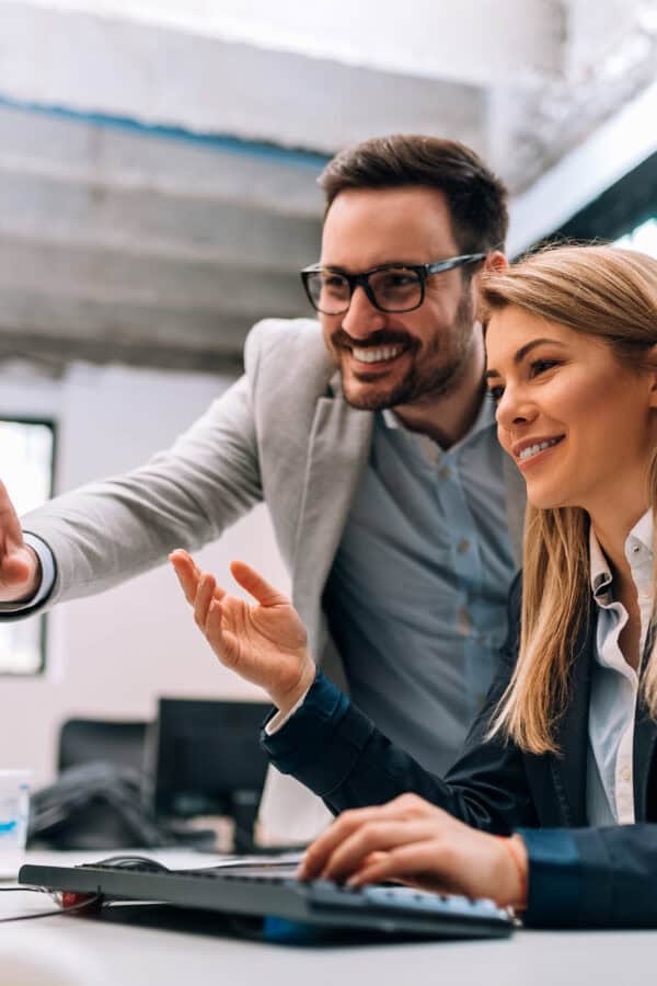 working together on project. two young business colleagues worki