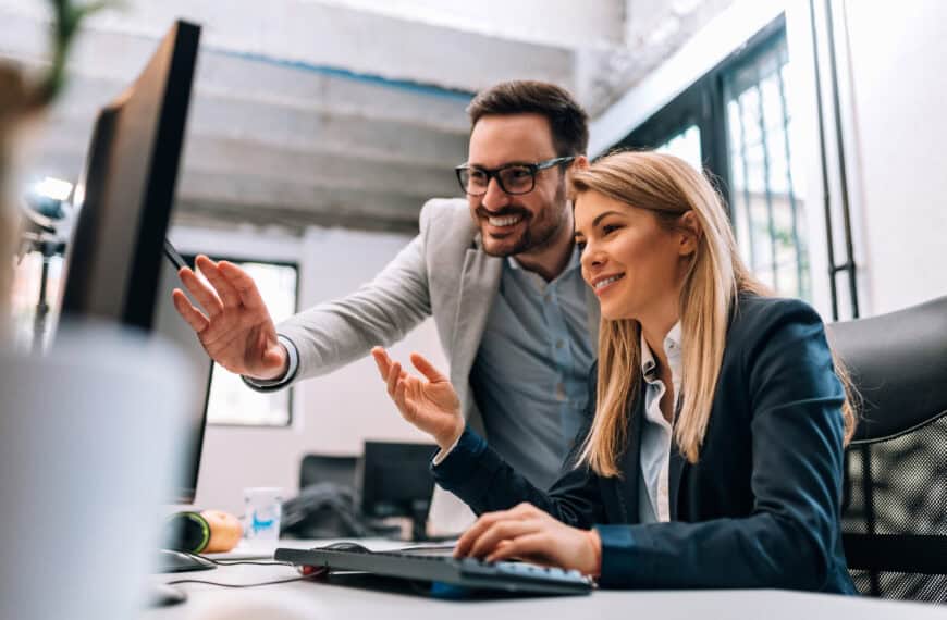 working together on project. two young business colleagues worki